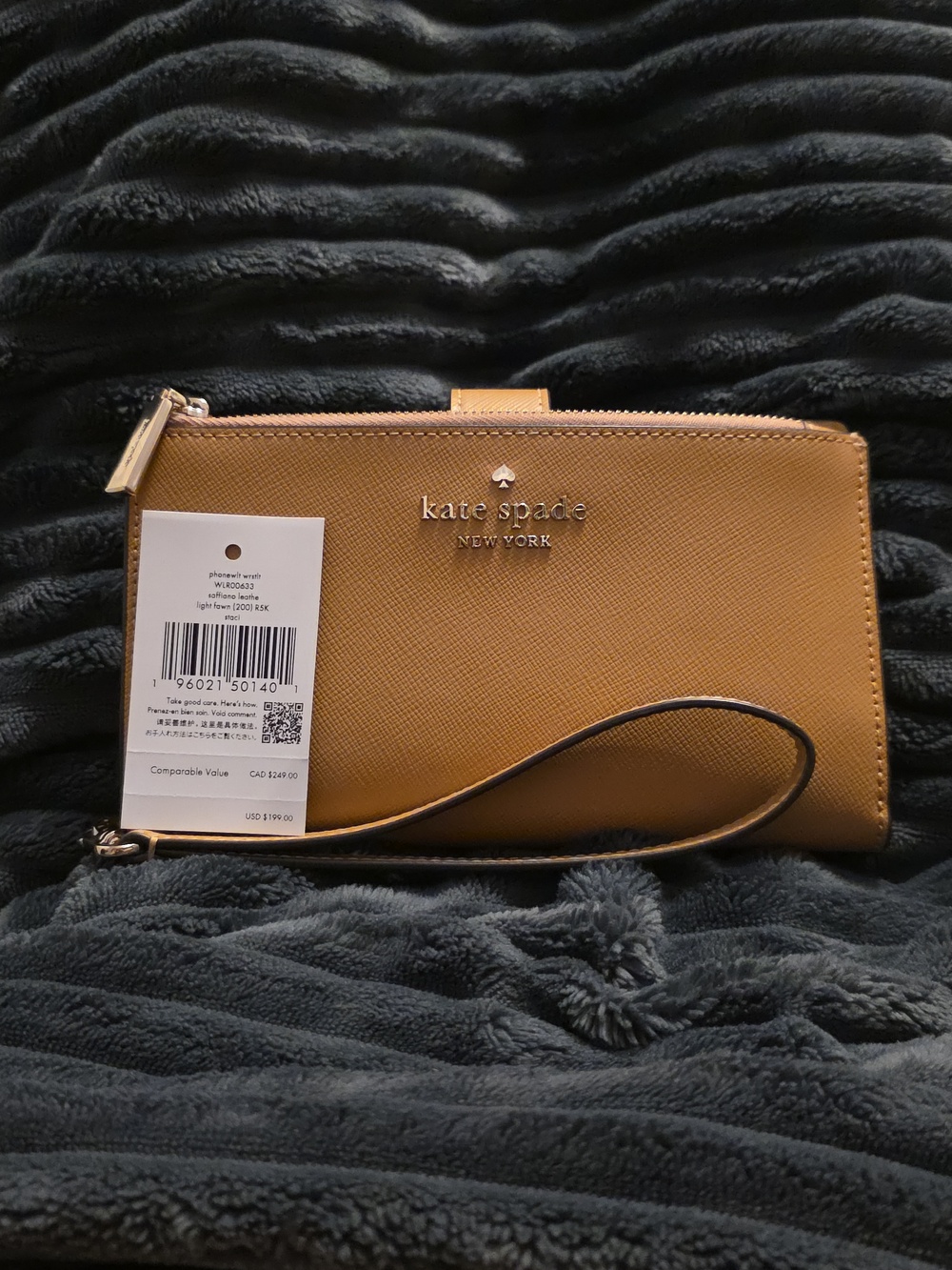 kate spade tan leather wristlet clutch with gold logo